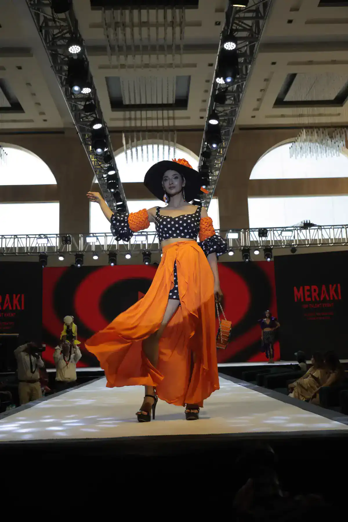 Meraki 2026 — solo model walk in orange couture